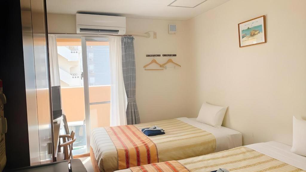 Hotel Peace Land Kume Naha Buitenkant foto