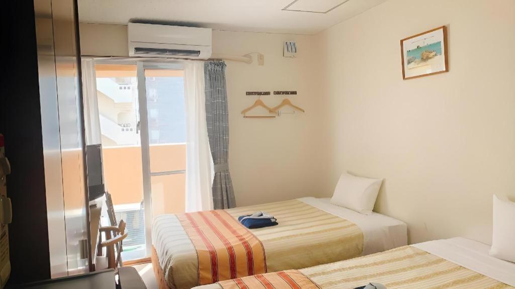 Hotel Peace Land Kume Naha Buitenkant foto