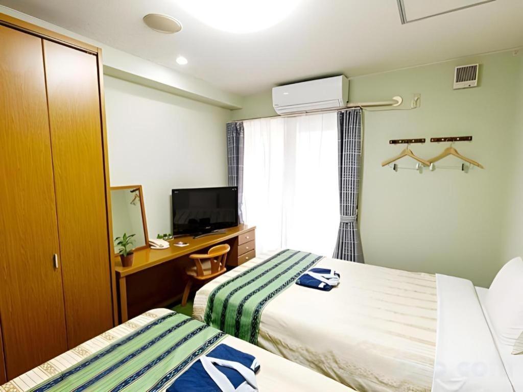 Hotel Peace Land Kume Naha Buitenkant foto